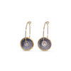 Pair of earrings with gold hoops and circular purple discs on a white background