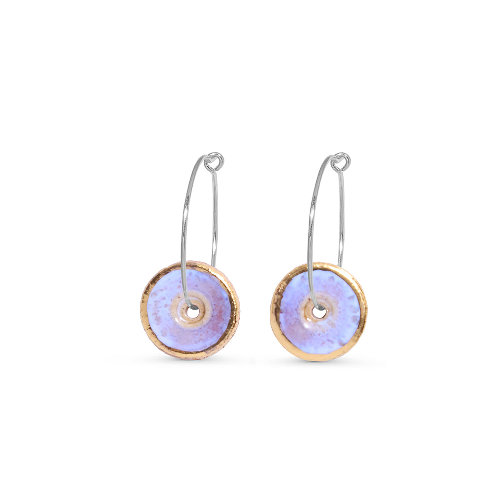 Pair of hoop earrings with round opal and gold disc charms on a white background