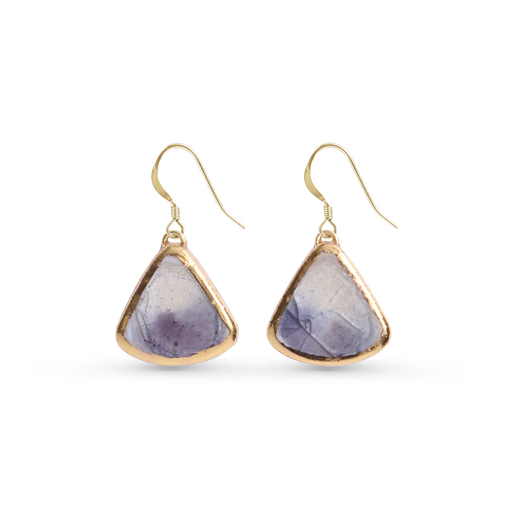 Pair of gold-framed purple stone earrings on a white background