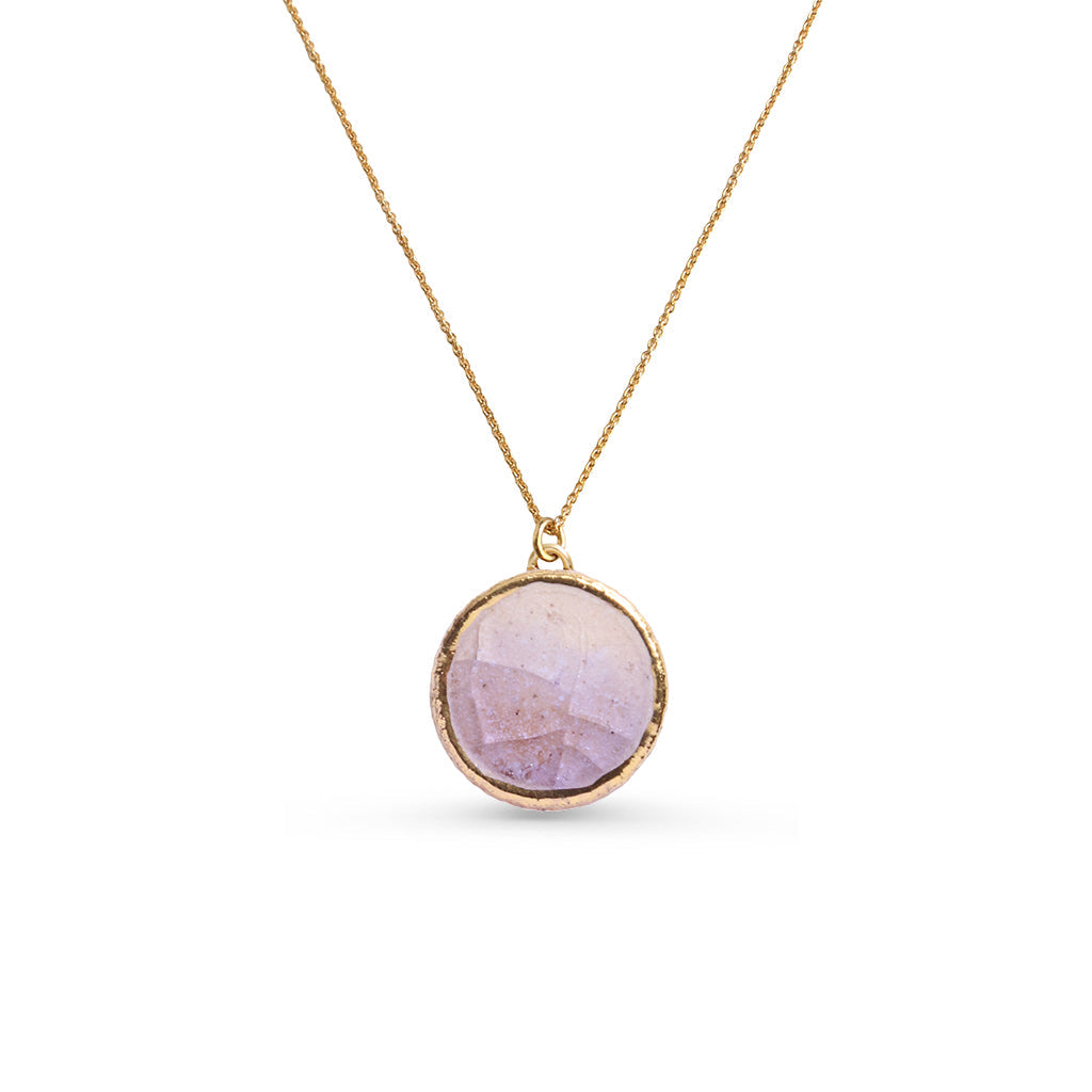 Necklace with a pink purple pendant on a white background