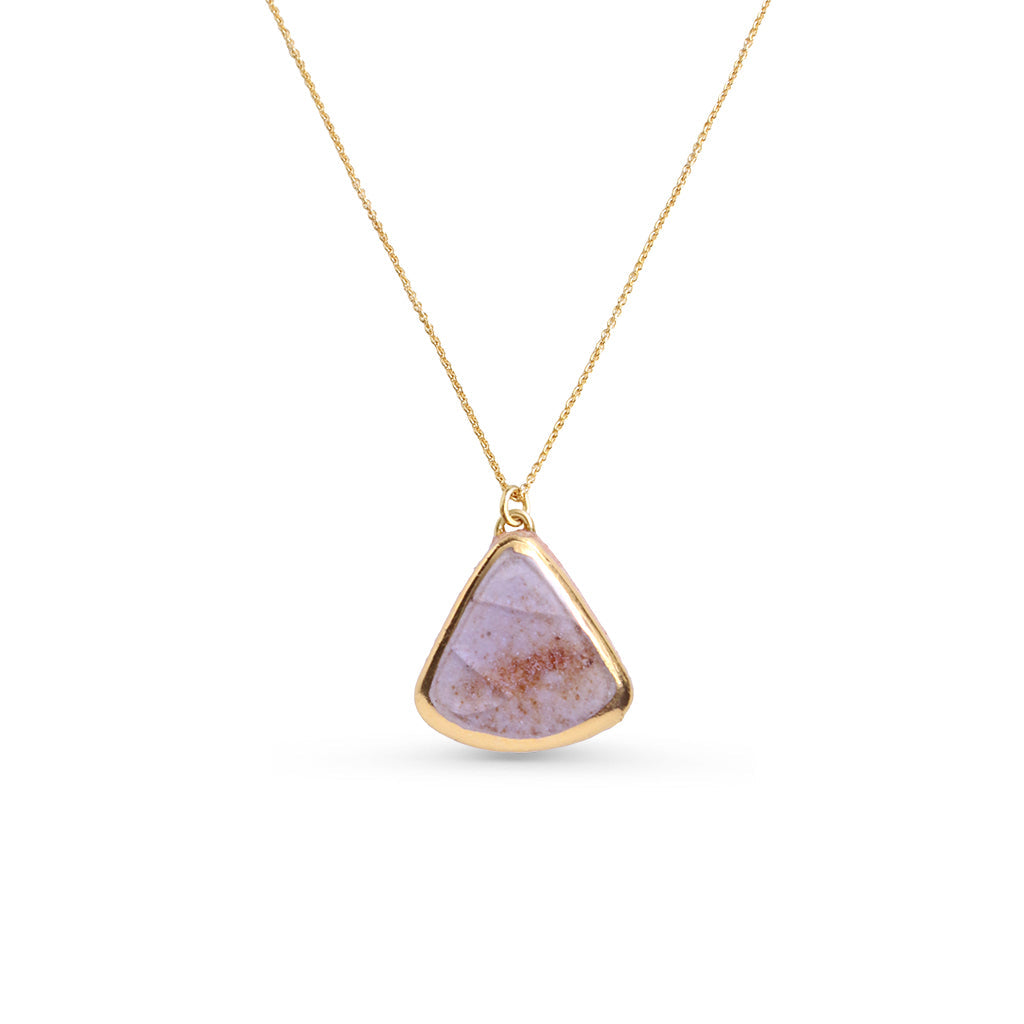 Necklace with a triangular purple pendant on a gold chain against a white background