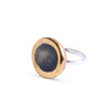 Ring with gold and silver design on a white background